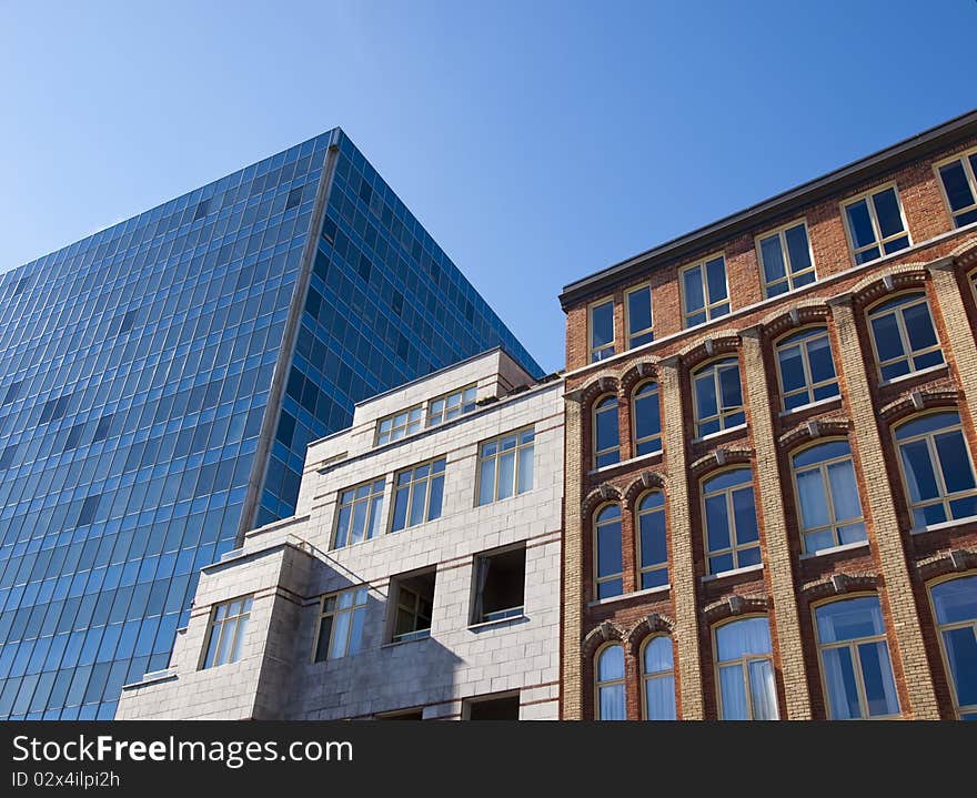 Three buildings of different style beside each other. Three buildings of different style beside each other