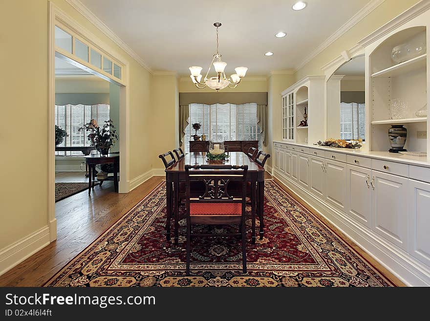 Dining room with white cabinetry