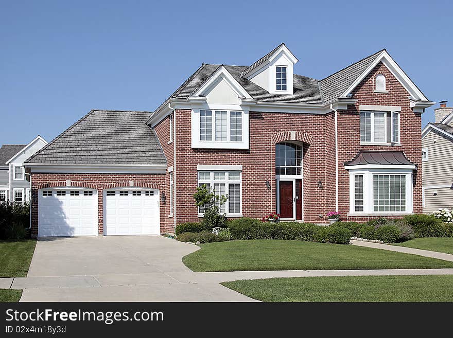 Brick home in suburbs with arched entry. Brick home in suburbs with arched entry