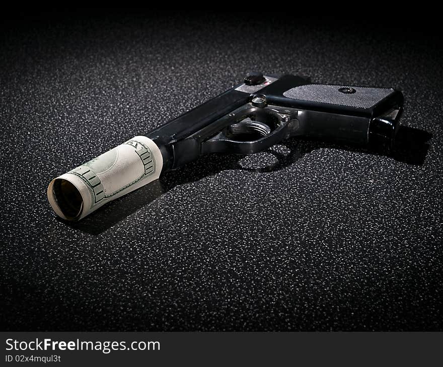 Handgun with imitation of silencer from dollar greenback. Handgun with imitation of silencer from dollar greenback