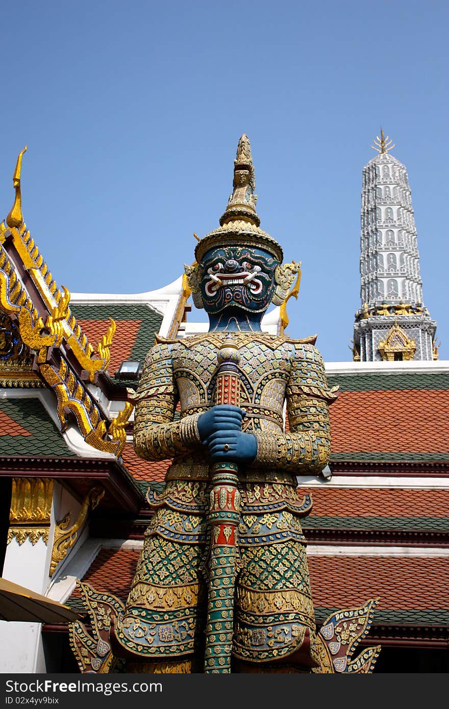 A thai temple guard in front of great door in thailand