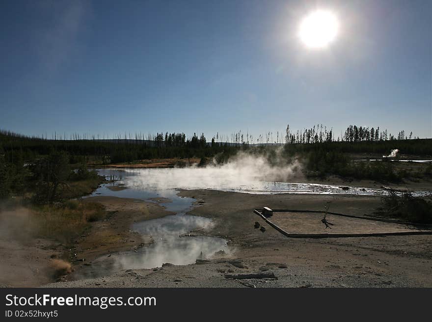 Norris geyser basin yellow stone national park with sun. Norris geyser basin yellow stone national park with sun