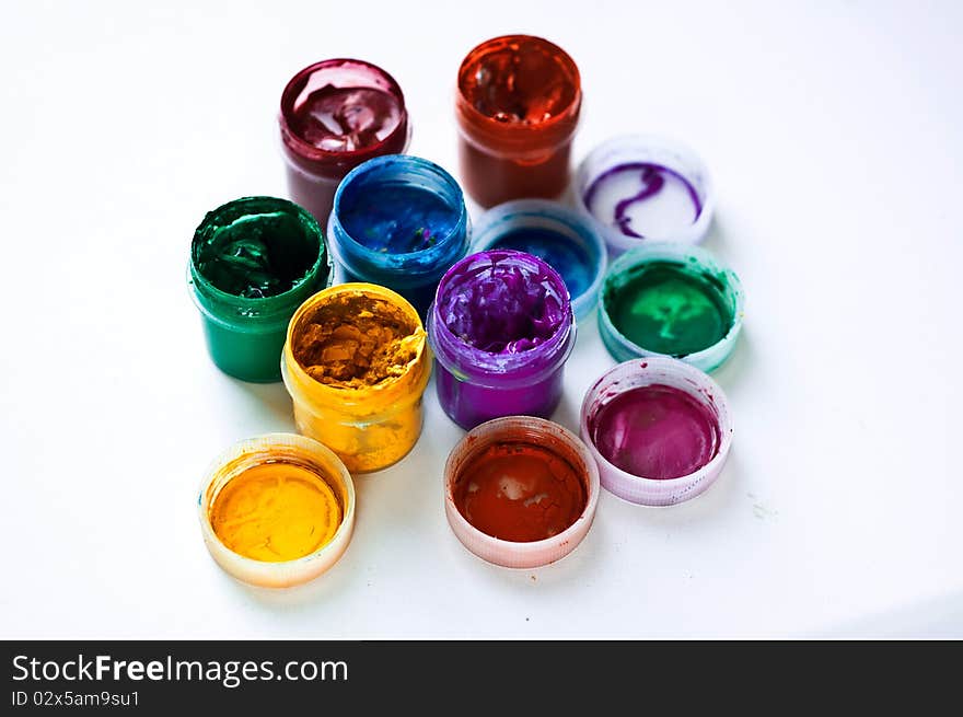 Banks with a multi-colored paint on a white background. Banks with a multi-colored paint on a white background