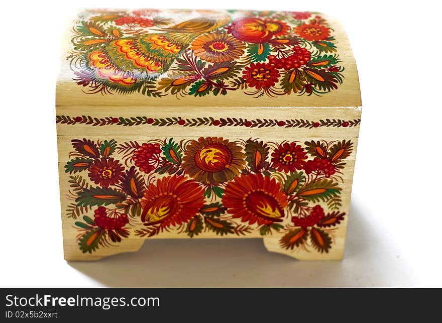 Wooden casket with Russian patterns on a white background