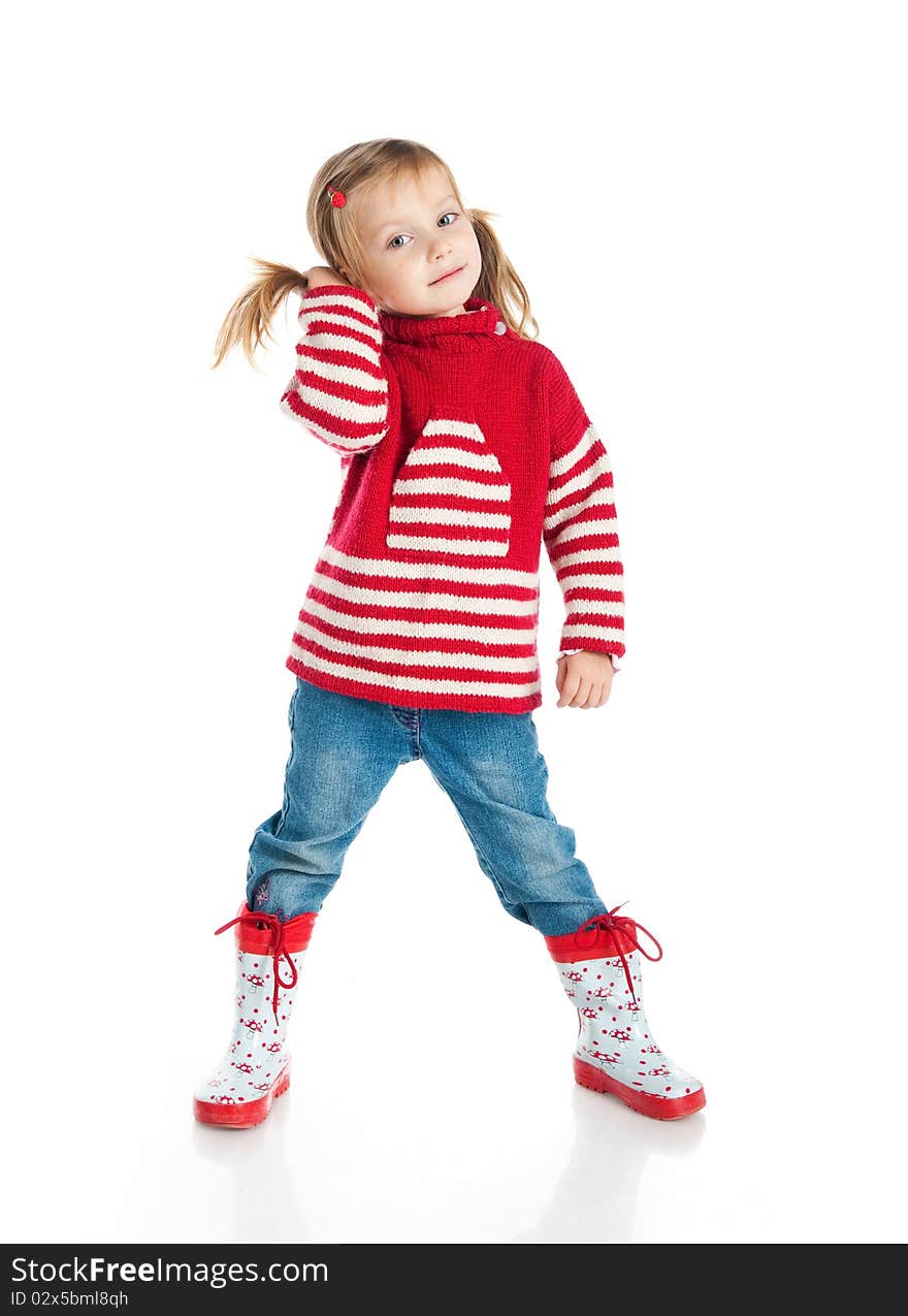 Little girl wearing sweater and gumboots isolated on white