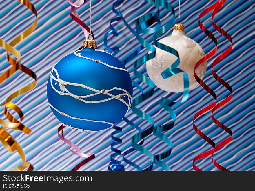 Christmas decoration from two blue and white balls. Blue background. Christmas decoration from two blue and white balls. Blue background