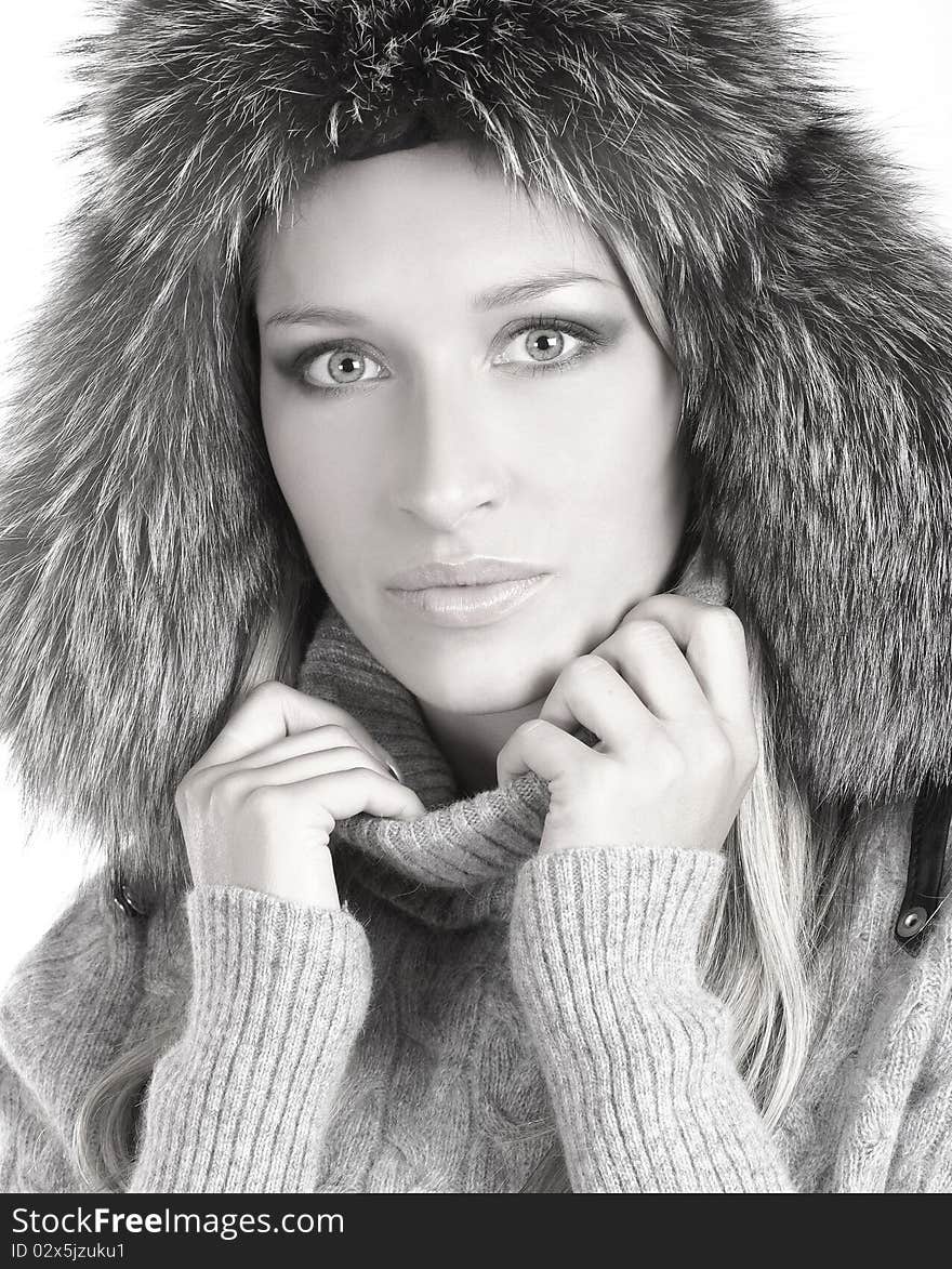 Portrait of a young and attractive woman in a winter hat. The image is isolated on a white background and slightly desaturated. Portrait of a young and attractive woman in a winter hat. The image is isolated on a white background and slightly desaturated.