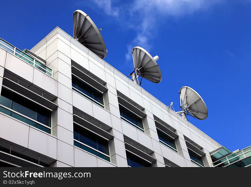 Pointing at the sky, satellite dishes.