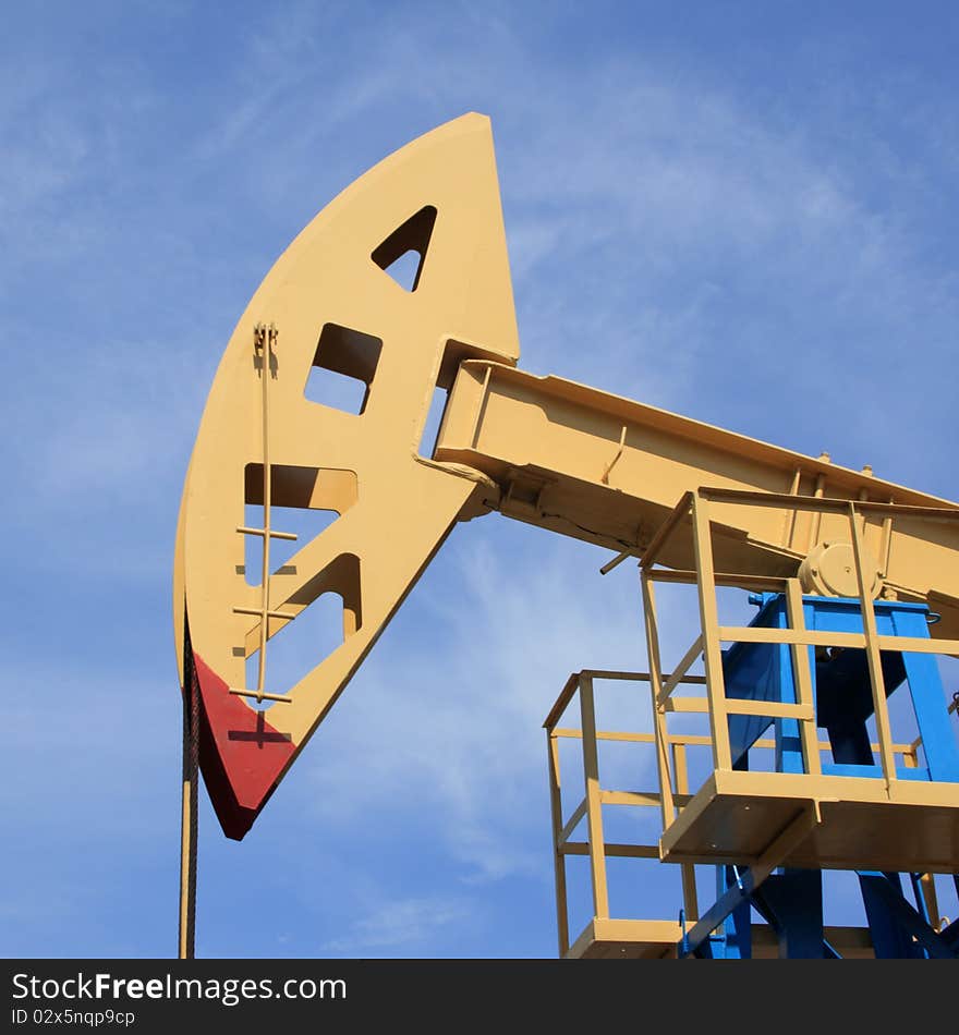 Oil rocking chair of yellow colour against the dark blue sky