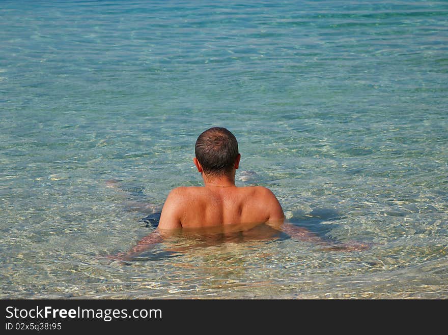 A man resting in the sea. A man resting in the sea