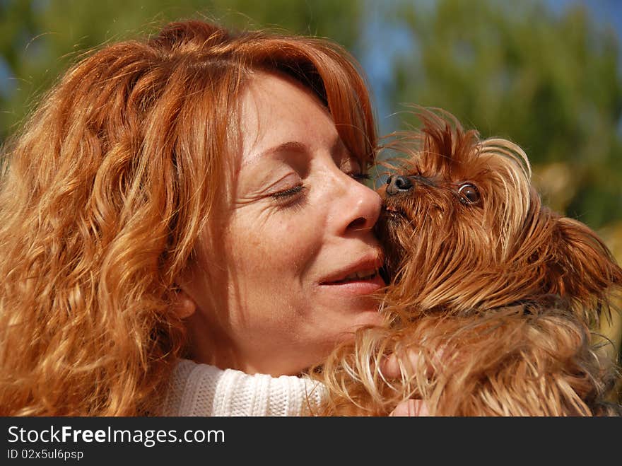 Woman with red hair and her purebred yorkshire terrier. Woman with red hair and her purebred yorkshire terrier