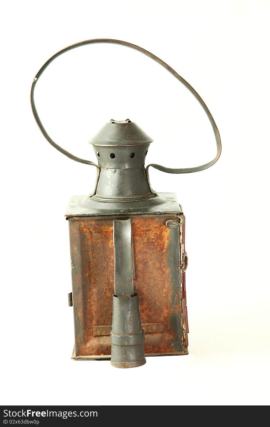 Old rusty railroad lamp with a red glass with Clipping path. Old rusty railroad lamp with a red glass with Clipping path