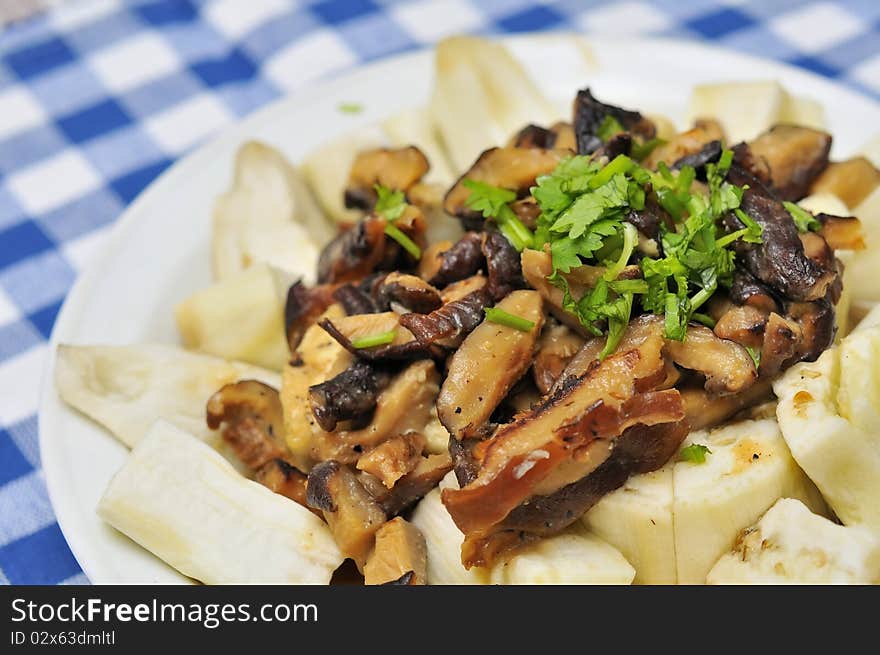 Unique Chinese style brinjal dish with generous mushroom topping.