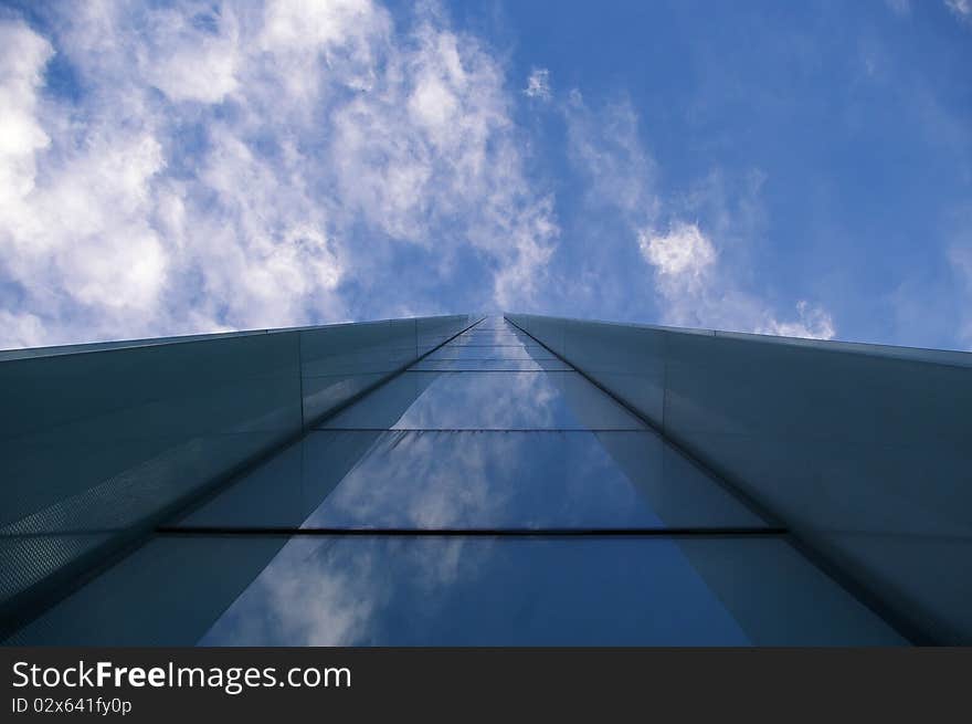 Office Building in Bucharest, Romania, shot from beneath it, with mirrored windows. Office Building in Bucharest, Romania, shot from beneath it, with mirrored windows.