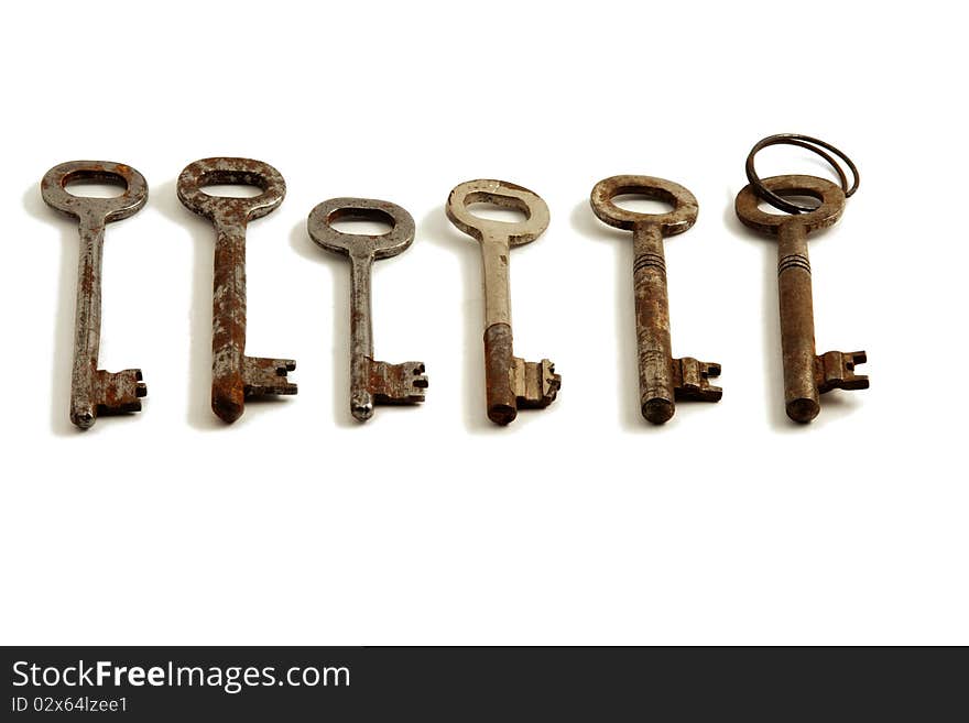 Old keys on white background