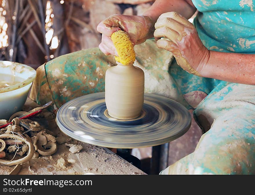 Close up of the hands of a potter