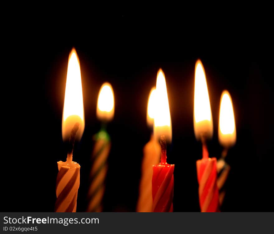 Candles isolated on black background