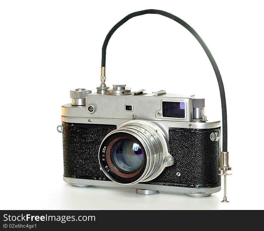 Old photographic  camera on bright background. Old photographic  camera on bright background