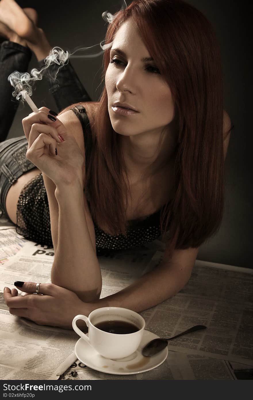 Beautiful young woman smoking cigarette. Beautiful young woman smoking cigarette