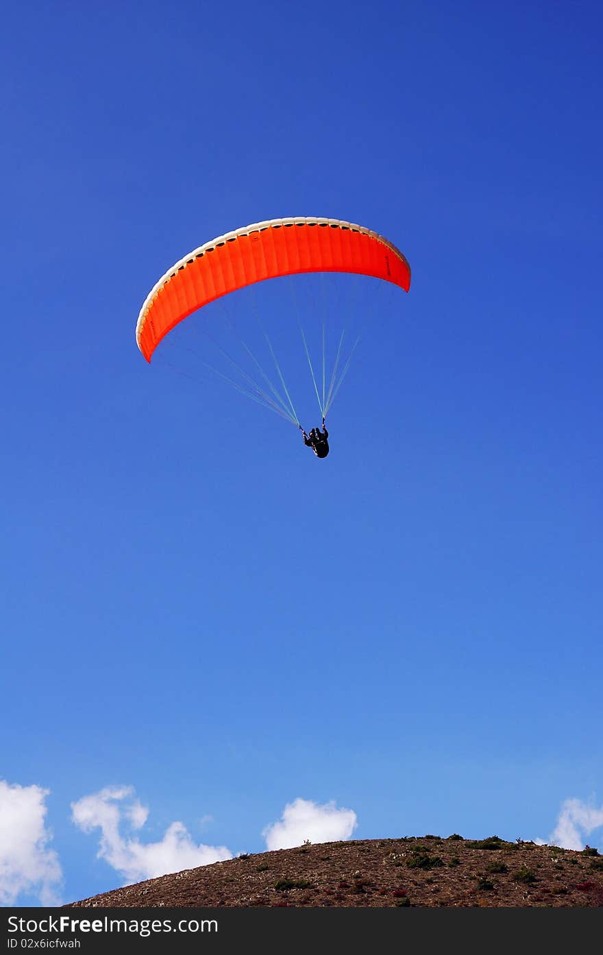 Athletes with a paraglider launches Orange. Athletes with a paraglider launches Orange