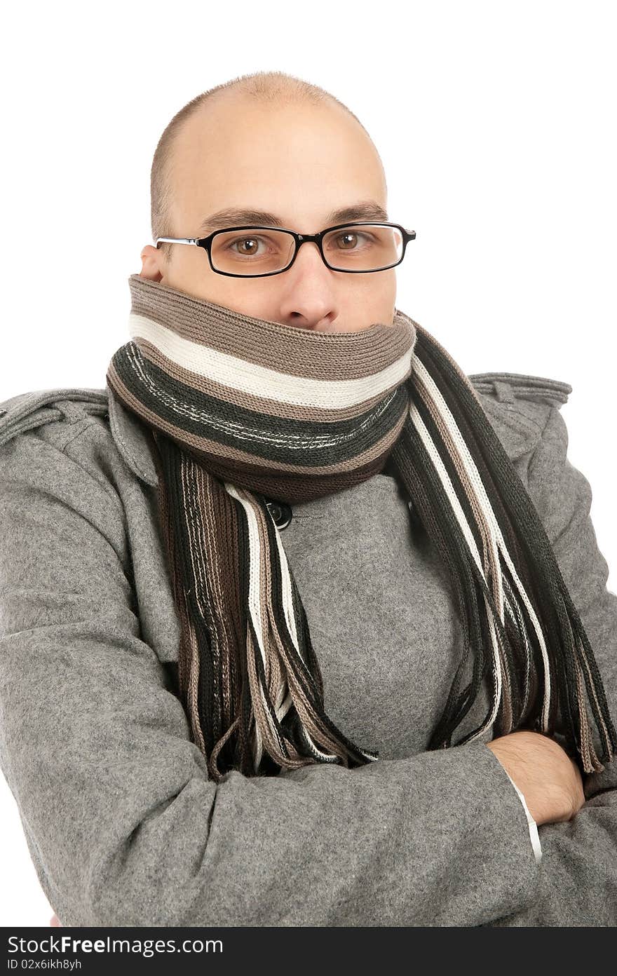 Studio picture of a young man dressed for winter