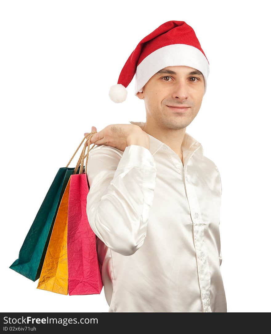 Young men in christmas red hat with paper presents bags. Young men in christmas red hat with paper presents bags