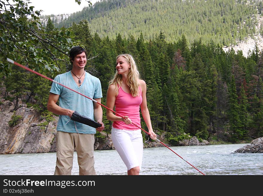 Couple setting up tent