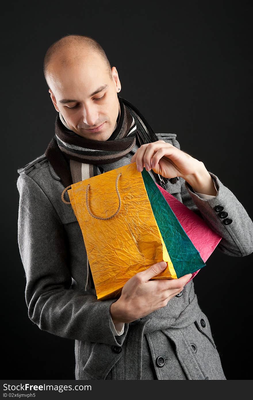 Young man with shopping bags