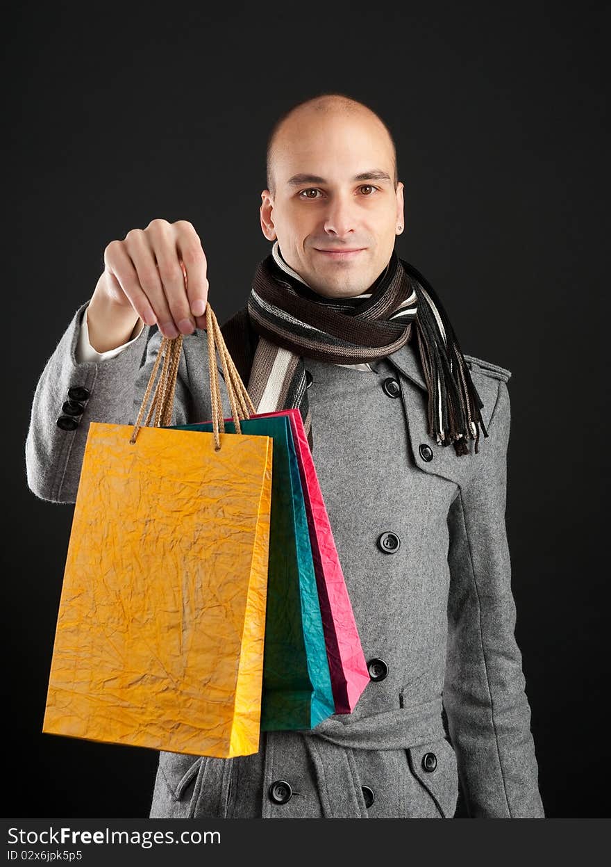 Young man with shopping bags