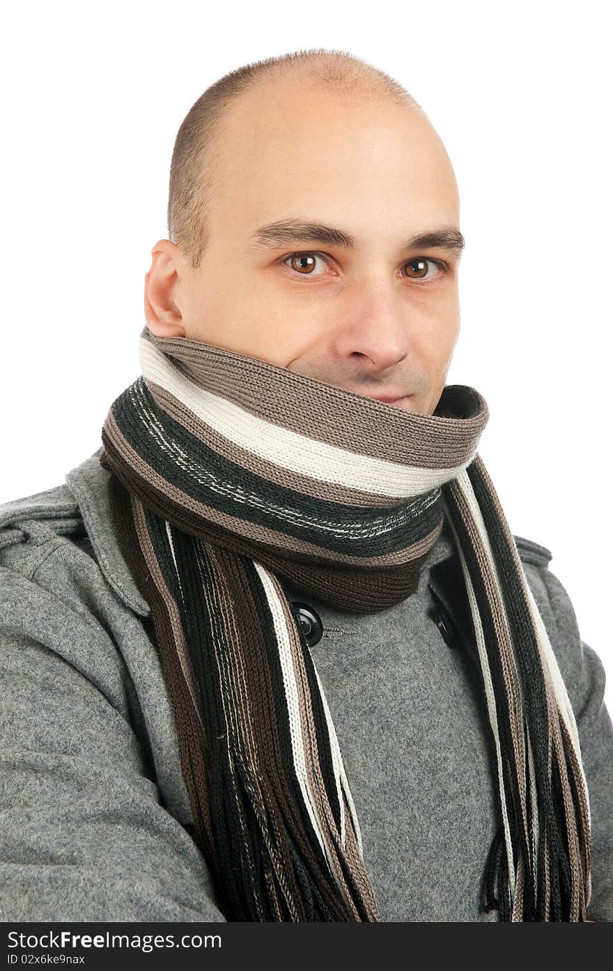 Attractive male wearing a coat and scarf. Attractive male wearing a coat and scarf