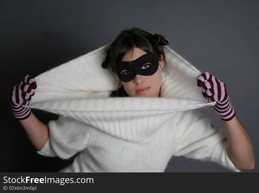 Portrait of woman with mask, glove and pull covering head. Portrait of woman with mask, glove and pull covering head