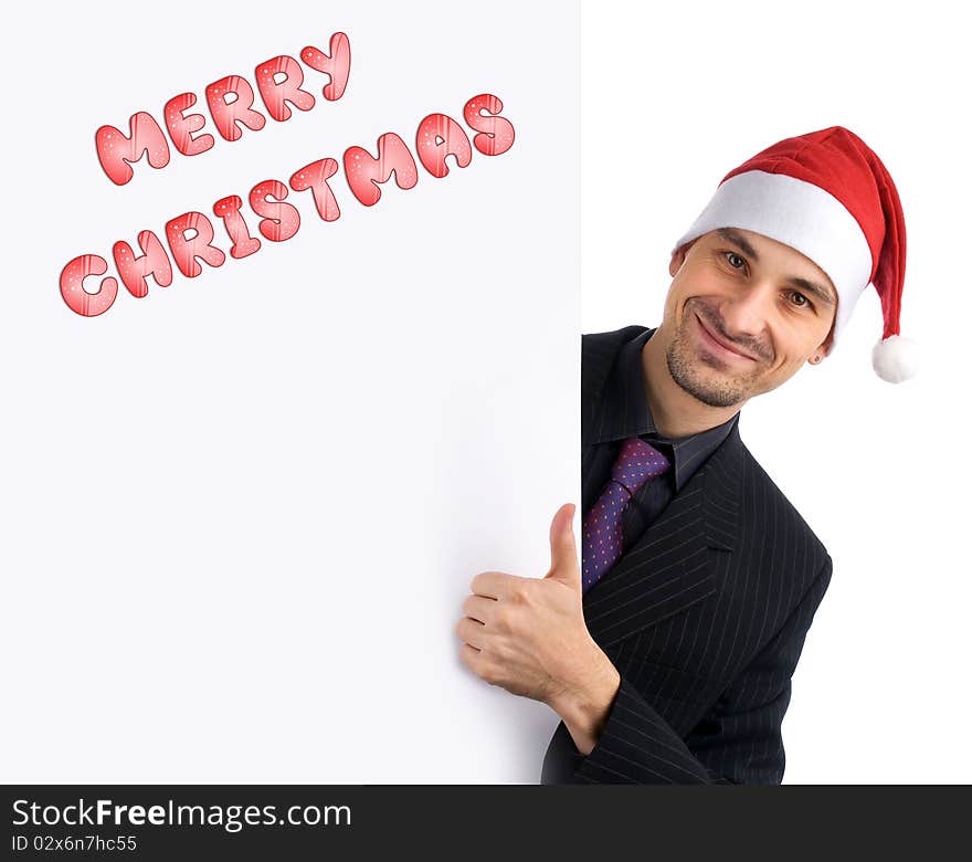 Christmas concept. Young businessman holding blank white card.