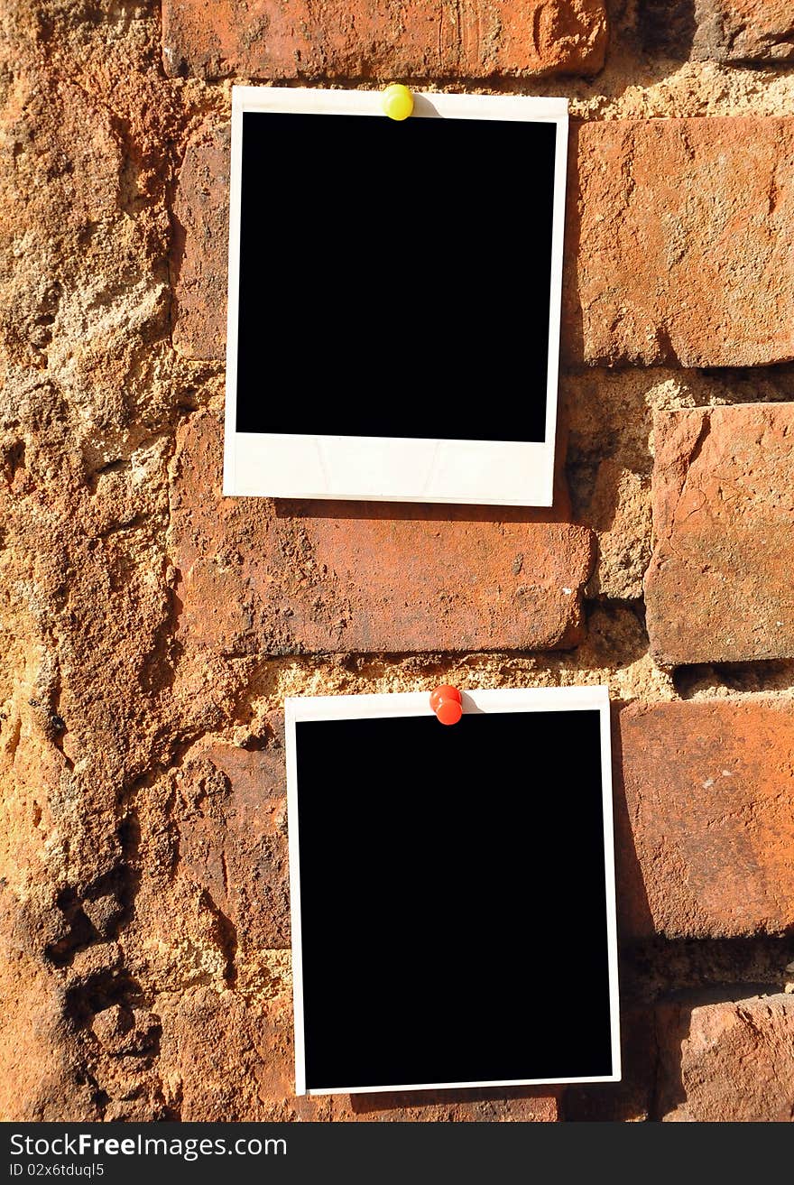 Old photo pressed the pushpin against a brick wall. Old photo pressed the pushpin against a brick wall