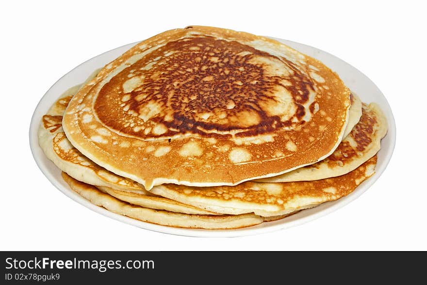 Wheaten pancakes on a plate isolated on a white background