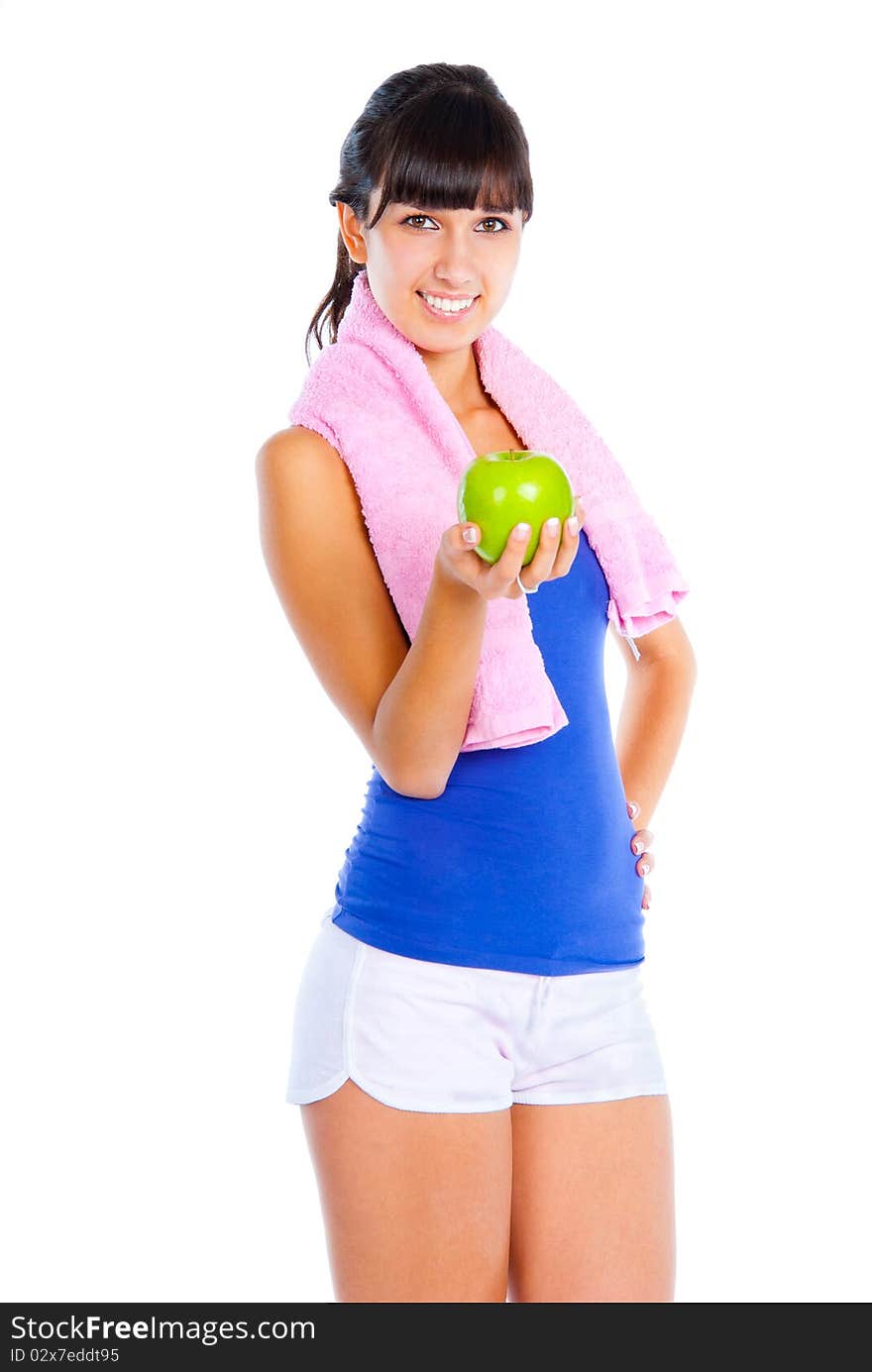 Young woman with green apple in the hand after fitness. Isolated over white