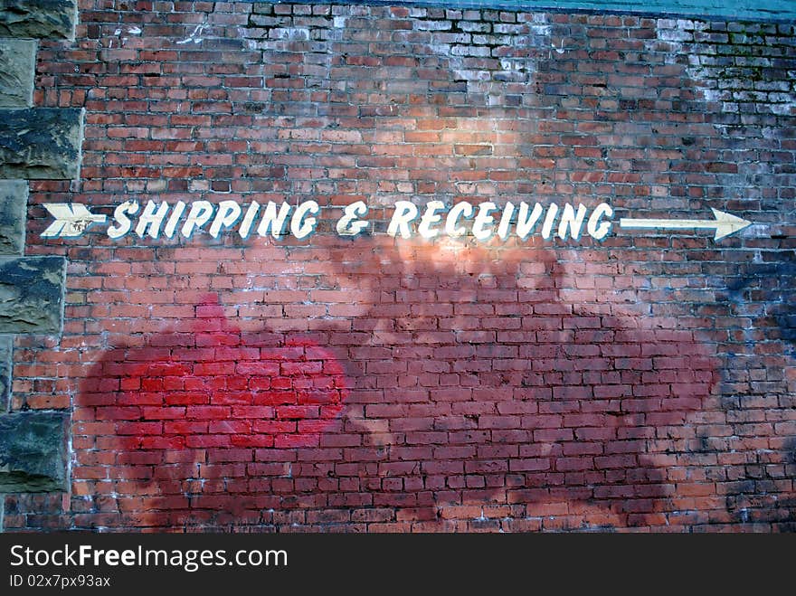 Shipping and recieving sign on an old building