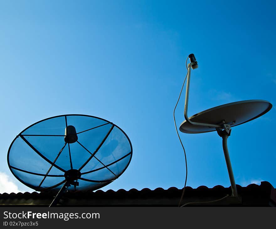 Two kinds of satellite on the roof with blue sky. Two kinds of satellite on the roof with blue sky