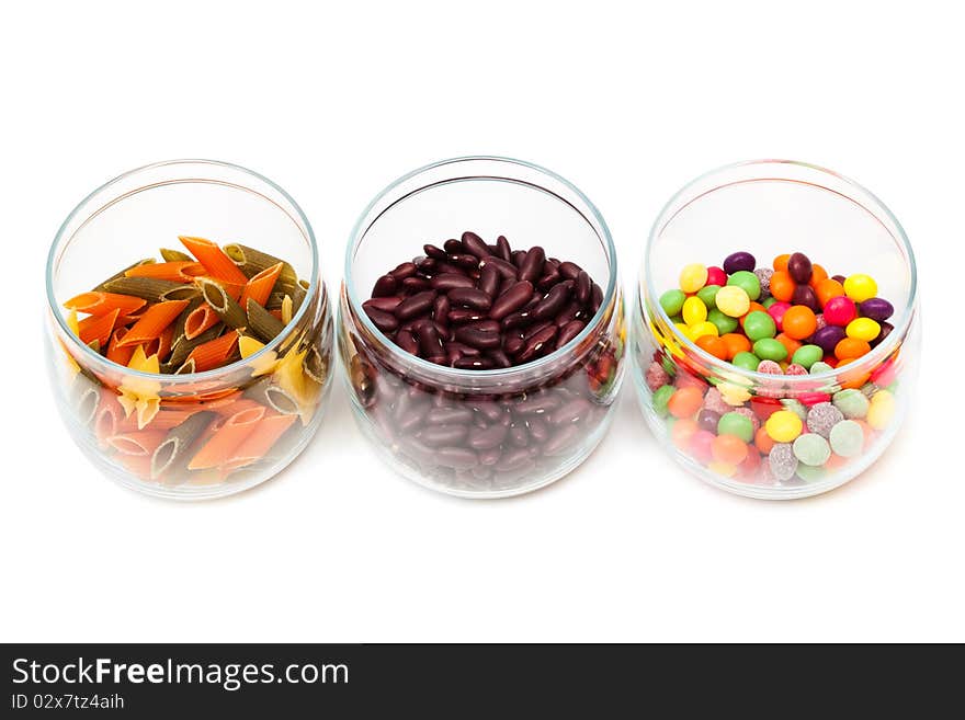 Food in glass jars on a white background