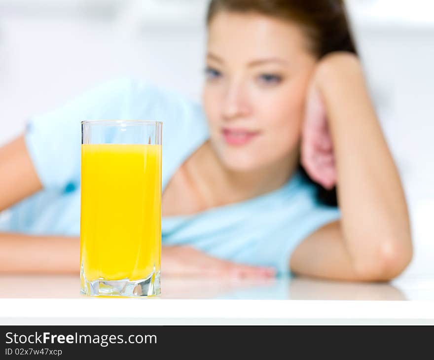 Girl With A Glass Of Fresh Orange Juice