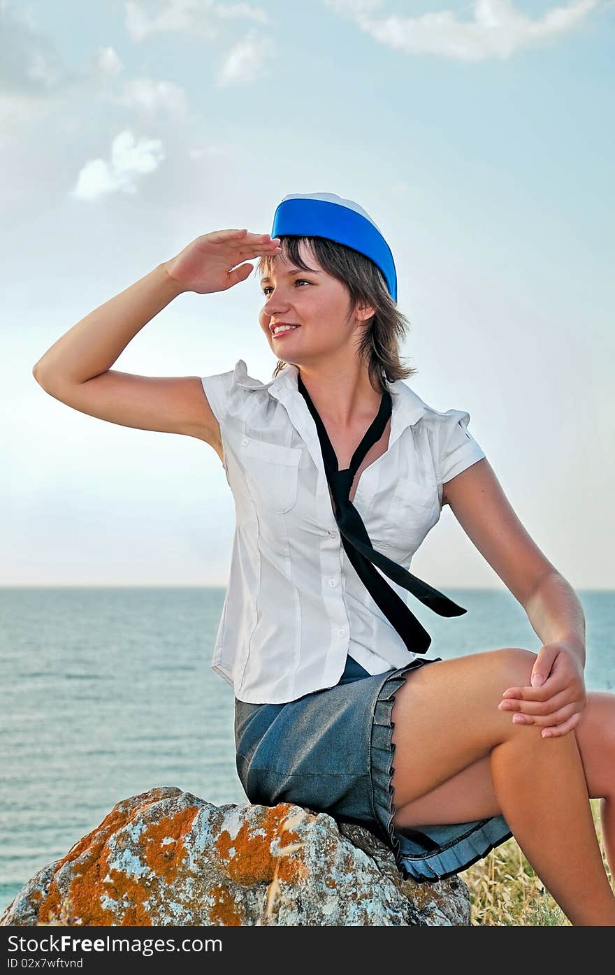 Attractive woman stewardess looks into the distance