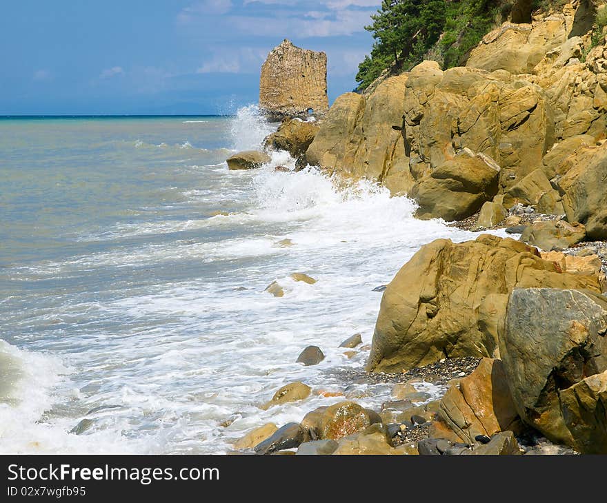 Seacoast with rocks and blue sky summer landscape copyspace. Seacoast with rocks and blue sky summer landscape copyspace