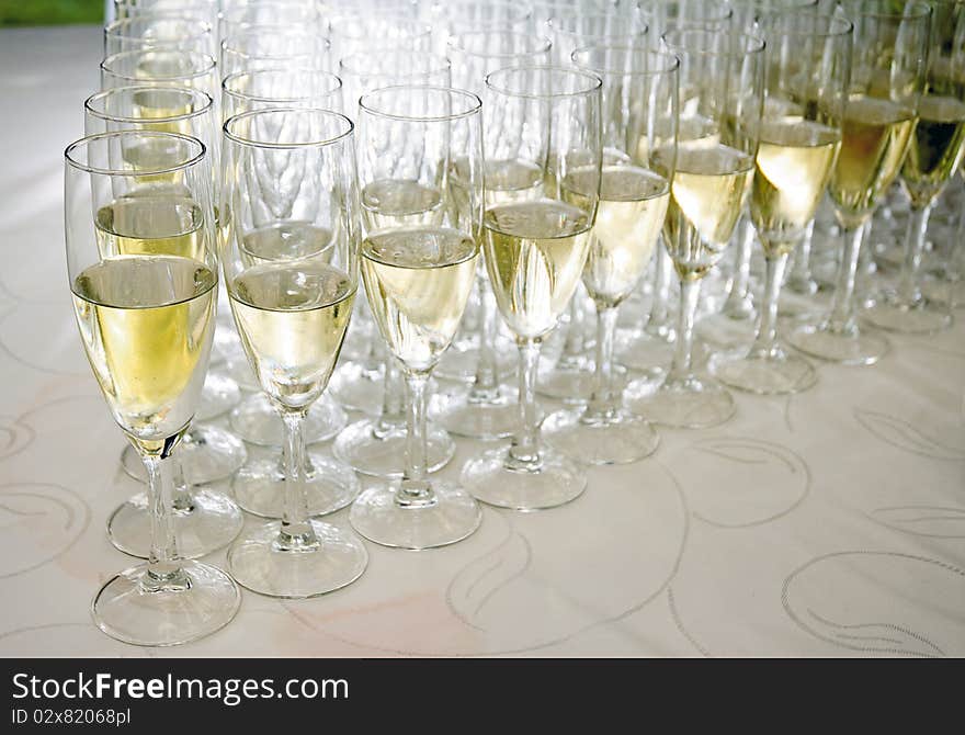 Glasses with white wine over a cocktail table