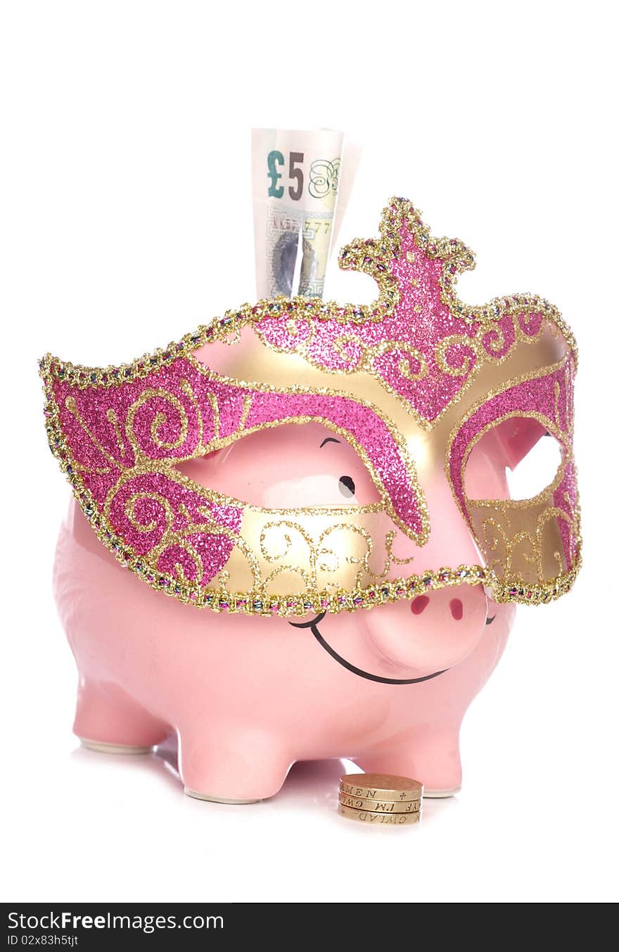 Piggy bank with masquerade party mask cutout. Piggy bank with masquerade party mask cutout