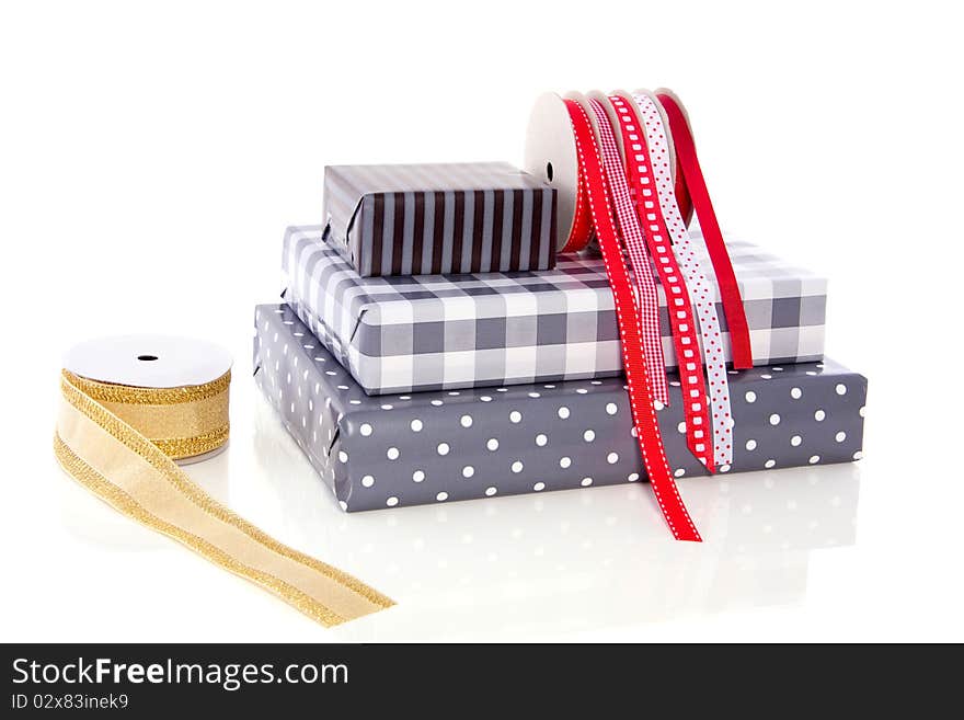 Gifts ribbons and wrappingpaper isolated on white background