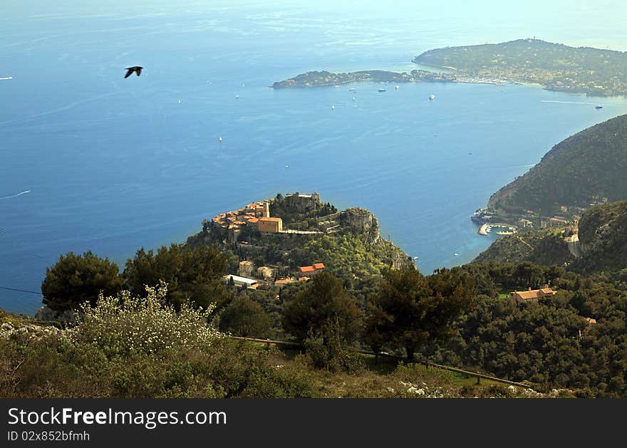 View of Eze, a medieval village of the French Riviera. On the upper right hand side of image is very famous Saint Jean Cap Ferrat, where many multi-millionnaires from all over the world, (including the richest American) have a residence. View of Eze, a medieval village of the French Riviera. On the upper right hand side of image is very famous Saint Jean Cap Ferrat, where many multi-millionnaires from all over the world, (including the richest American) have a residence.