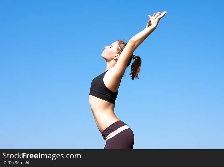 Young woman with arms outstretched