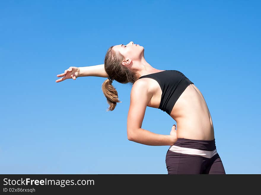 Young woman with arms outstretched