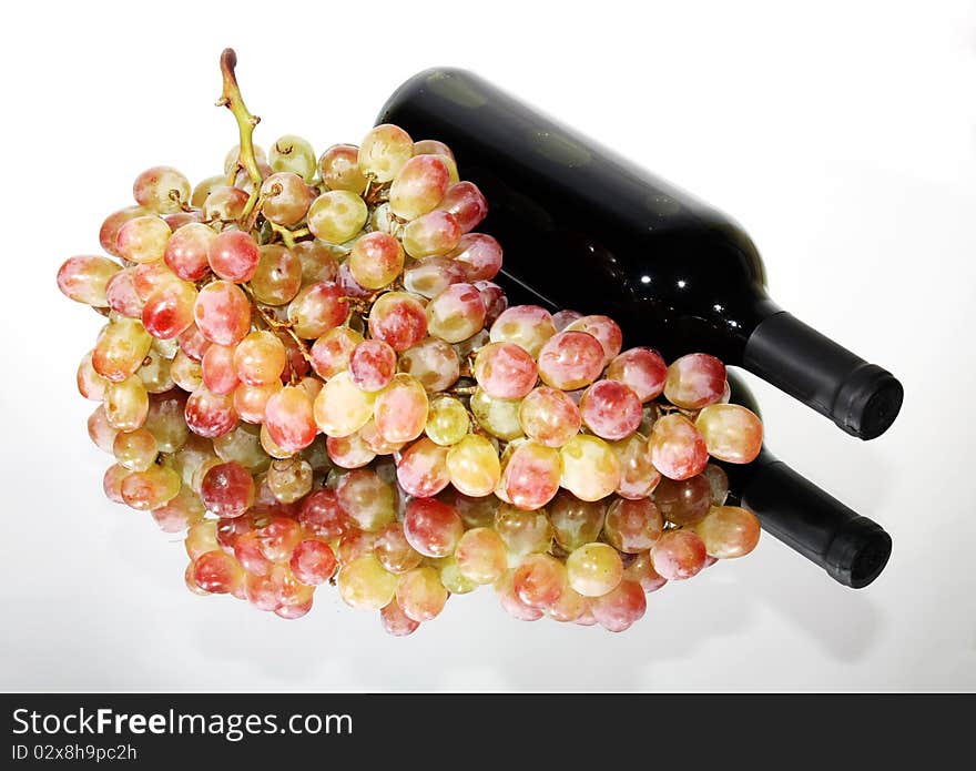 Bunch of grapes and wine bottle. Bunch of grapes and wine bottle