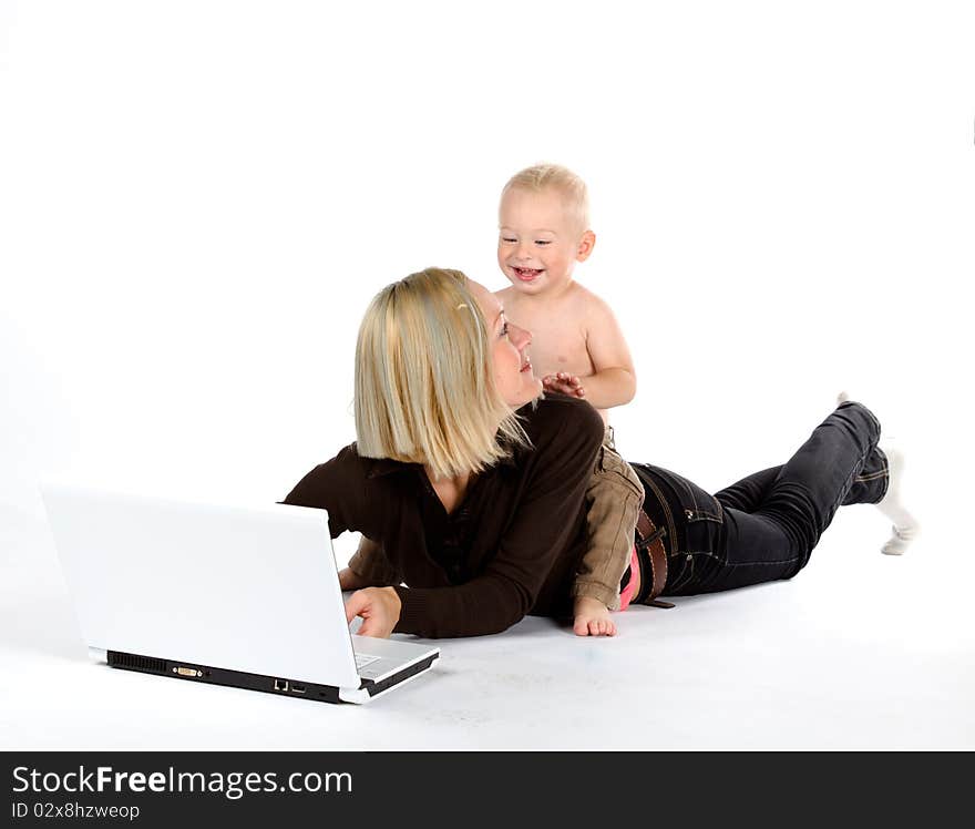 Mother and baby with laptop, isolated on white background. Mother and baby with laptop, isolated on white background