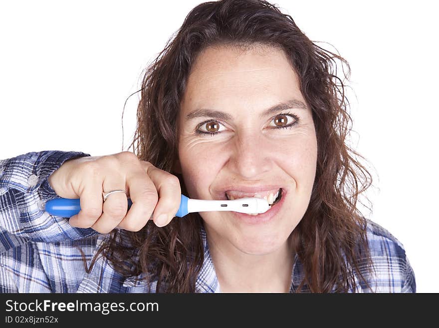 Woman brushing teeth close